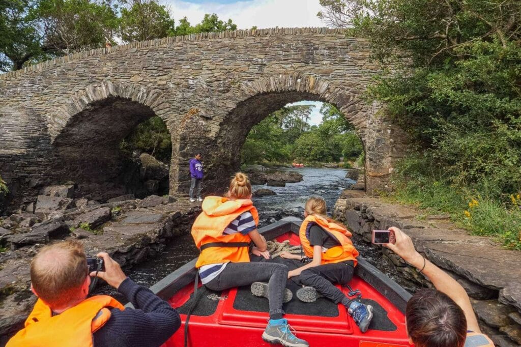 Family going through meeting of the waters on Gap of Dunloe boat