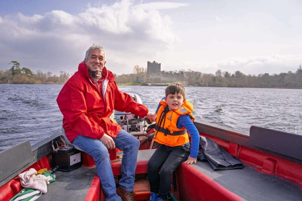Young boy on boat on lakes of Killarney